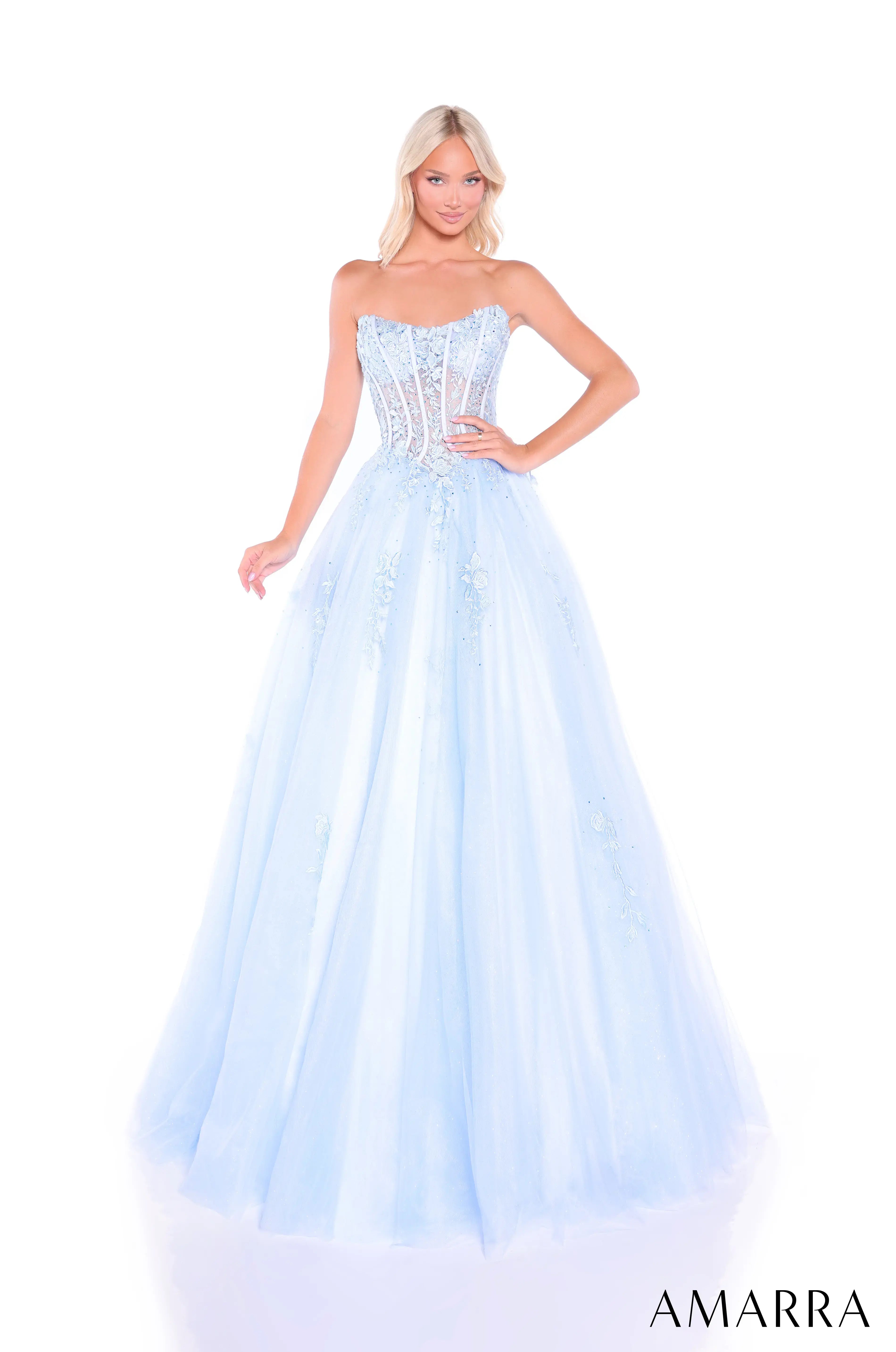 Woman wearing a light blue strapless gown with 'AMARRA' branding on a white background