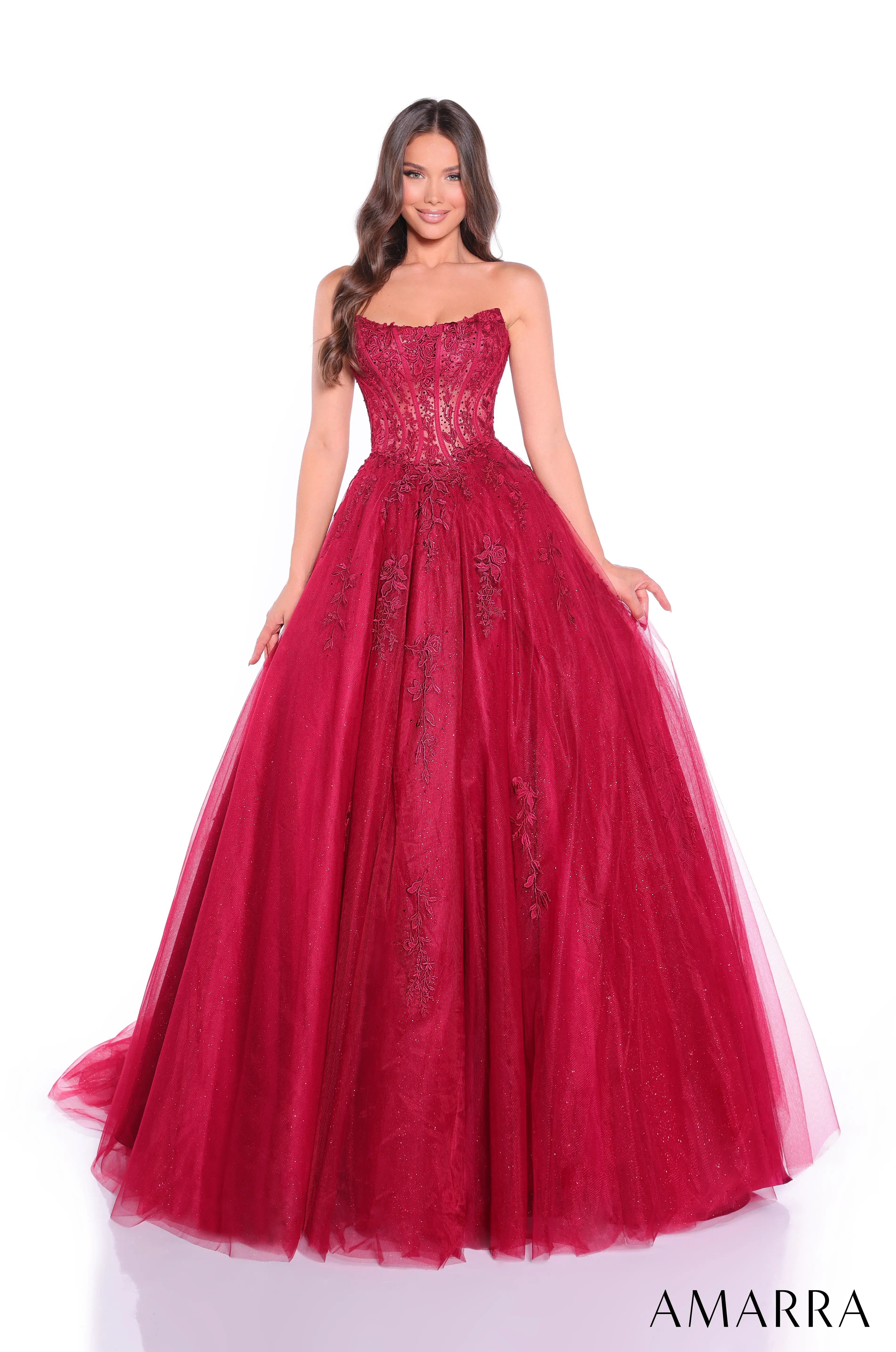 Red evening gown with lace details on a white background, featuring the brand 'AMARRA'.