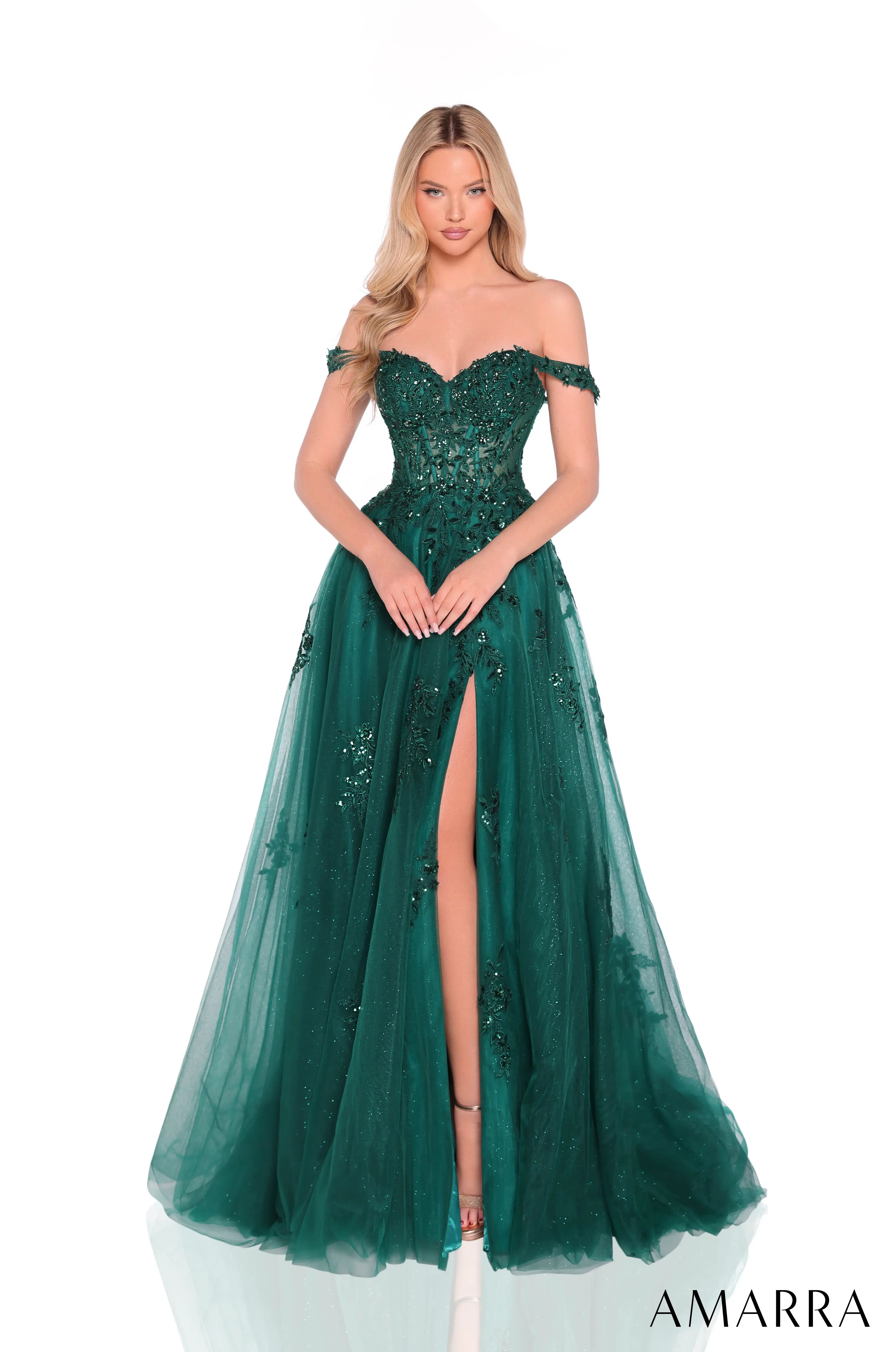 Woman wearing a green off-shoulder evening gown with a high slit on a white background, branded 'AMARRA'.